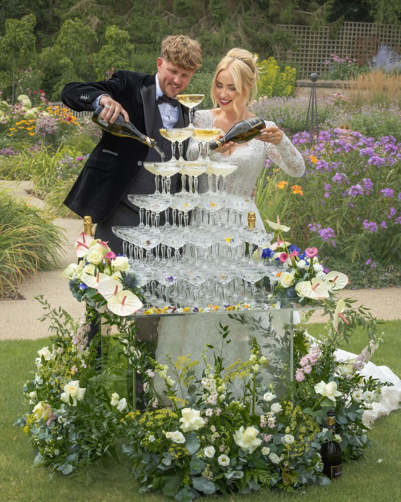 6 Tier Champagne Tower with Fresh Edible Violas and Fresh Floral Styling at Salt House Staffordshire